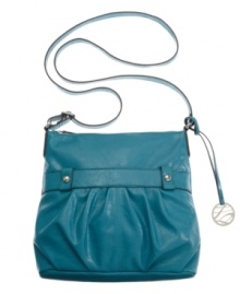 Add a pop of color with this cool crossbody design by Style&co. Dome studs, silvertone hardware and a charm at side complete this lovely look. Add a pop of color with this cool crossbody design by Style&co. Dome studs, silvertone hardware and a charm at side complete this lovely look.