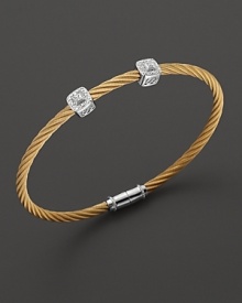 From the Celtic Noir Collection, a stackable bangle in yellow gold and stainless steel with diamond stations. Designed by Charriol. From the Celtic Noir Collection, a stackable bangle in yellow gold and stainless steel with diamond stations. Designed by Charriol.