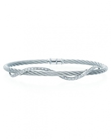 A twist of diamonds and white gold winds around stainless steel bangle. By Charriol.