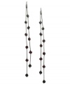 Fire up your evening with these two-row linear earrings from GUESS. Amythest, fuchsia and rose crystal-embellished fireballs hang from metal chains. Crafted in sprayed jet mixed metal. Approximate drop: 7 inches.