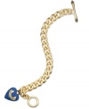 Juicy Couture's lovely bracelet gets your heart racing with a banner heart charm embellished with blue pave accents. Complete with a toggle closure. Chain crafted in gold tone stainless steel. Charms crafted in gold tone mixed metal. Approximate length: 7 inches. Approximate drop: 1 inch.