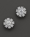 White gold diamond flower cluster earrings. With signature ruby accent. Designed by Roberto Coin.