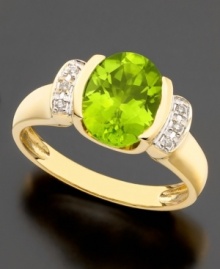 August's birthstone glows bright on this beautiful ring featuring oval-cut peridot (2-3/5 ct. t.w.) and round cut diamond accents set in 14k gold. August's birthstone glows bright on this beautiful ring featuring oval-cut peridot (2-3/5 ct. t.w.) and round cut diamond accents set in 14k gold.