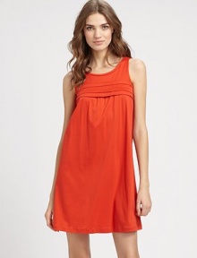 Soft, flowing jersey knit in a bold color is the perfect way to welcome spring, with pleated detailing for added drape. JewelneckSleevelessPleated detailing at the yoke and soft shirringA-lineAbout 35½ from shoulder to hemMercerized cottonMachine washImported