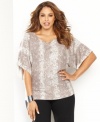 Channel your wild side in INC's snakeskin-print plus size top, complete with shining sequins. In a dolman-sleeve silhouette and neutral palette, it makes just the right impact.