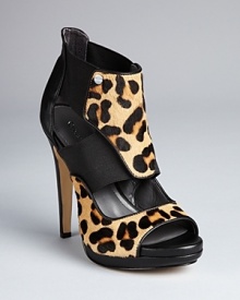 Calvin Klein has stepped up to the leopard trend with luxe high heel sandals that will make you the cat's meow.