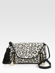 Bold leopard-print highlights this flap-front canvas bag, offset by a leather tassel and trim.Adjustable shoulder strap, 14½-15½ dropFlap snap closureTwo outside zip pocketsCotton lining10W X 6½H X 1¾DImported Bold leopard-print highlights this flap-front canvas bag, offset by a leather tassel and trim.Adjustable shoulder strap, 14½-15½ dropFlap snap closureTwo outside zip pocketsCotton lining10W X 6½H X 1¾DImported