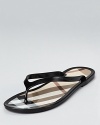 Embrace casual style with Burberry--these timeless flip flops turn kicking back into a stylish affair.