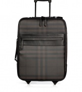 Travel in iconic style with Burberry Londons chocolate smoked check carry-on - Tonal leather trim, checked PVC, zip-around closure, zippered front pocket, retractable handle at back, reinforced base with wheels - The perfect size for carrying on-board, or for packing away chic weekend essentials