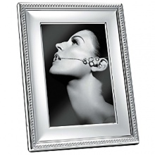 Showcase your most precious pictures with this highly polished silverplate frame embellished with raised dots. Its timeless design will add value to photos and style to your home. Showcase your most precious pictures with this highly polished silverplate frame embellished with raised dots. Its timeless design will add value to photos and style to your home.