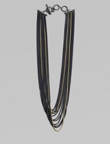An edgy piece with a beautiful drape in 18k gold and blackened sterling silver box link chains. 18K goldBlackened sterling silverLength, about 18Toggle closureImported An edgy piece with a beautiful drape in 18k gold and blackened sterling silver box link chains. 18K goldBlackened sterling silverLength, about 18Toggle closureImported