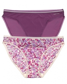 A scalloped lace trim lends a feminine finish to these printed and solid bikini briefs from Calvin Klein Underwear.