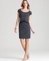 Retro polka dots are eye-pleasing for the office on this slim-fitting Nanette Lepore dress featuring ribbon detail at the waist for feminine flair.