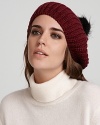 Top off your cold-weather look with this chic, slouchy beret from Eugenia Kim. A pom pom adds playful edge.