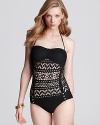 Reveal your hippie chic side with this crochet one-piece from Robin Piccone. It's designed to make a bold statement with button detailing and a peek-a-boo silhouette.