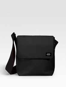 A sturdy, compact bag designed in nylon canvas for strength and durability. The body material is 1100 denier canvas, producing the greatest density between yarns and ensuring water resistance. Structured yet pliable, it is a sturdy fabric that eases with use. Flap/grip-tape closure Adjustable shoulder strap Padded computer slip pocket Exterior, interior organizing pockets Nylon canvas 9½W X 11¼H X 3½D Imported A sturdy, compact bag designed in nylon canvas for strength and durability. The body material is 1100 denier canvas, producing the greatest density between yarns and ensuring water resistance. Structured yet pliable, it is a sturdy fabric that eases with use. Flap/grip-tape closure Adjustable shoulder strap Padded computer slip pocket Exterior, interior organizing pockets Nylon canvas 9½W X 11¼H X 3½D Imported