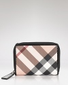 House cards and currency in Burberry's iconic check print with the Nova Burleigh wallet, a classic design with timeless style.