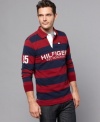 Secure your sporty style. Bold stripes make this Tommy Hilfiger rugby shirt a winning look.