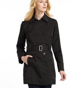 THE LOOKNotched collarDouble-breasted button front closureLong sleeves with three-button cuffsDual welt pockets with button closureButton tab at backAttached beltWater resistantMatching travel pouch includedTHE FITAbout 31 from shoulder to hemTHE MATERIALPolyesterCARE & ORIGINMachine washImported