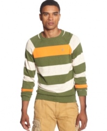 Bold colors mixed with a classic crew neck design give this Rocawear sweater its handsome style. Bold colors mixed with a classic crew neck design give this Rocawear sweater its handsome style.