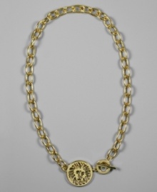 An etched lion medallion blazes with beauty on this confident necklace by AK Anne Klein. Crafted in goldtone mixed metal.  Approximate length: 17 inches.