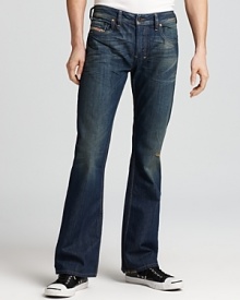 Every guy needs a pair of everyday jeans he can count on. Worn-in with fading detail, these Diesel jeans fit the bill, with a classic, regular fit for the ultimate in comfort and style. Every guy needs a pair of everyday jeans he can count on. Worn-in with fading detail, these Diesel jeans fit the bill, with a classic, regular fit for the ultimate in comfort and style.