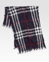 A luxurious blend of extra fine merino wool and cashmere in a signature check pattern with delicate fringed ends.Fringed ends18 x 7955% merino wool/45% cashmereDry cleanImported