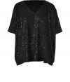 Easy and glamorous with its allover tonal sequins, DKNYs loosely draped dolman-sleeve tee counts as a must for your cocktails wardrobe - V-neckline, elbow-length dolman sleeves with stitched cuffs - Loosely draped fit - Wear with figure-hugging separates and statement heels