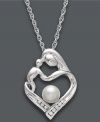 There's nothing like a mother's embrace. This symbolic pendant features a mother and child in a loving heart shape. Necklace combines polished sterling silver, a cultured freshwater pearl (5 mm), and sparkling diamond accents. Approximate length: 18 inches. Approximate drop: 3/4 inch.