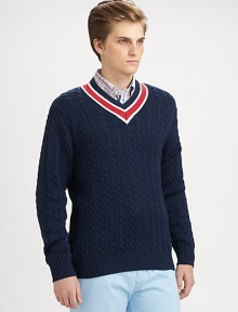 Layer up, remain warm and cozy and beat the season's chills in this incredibly knit v-neck sweater with a contrasting collar detail.V-neckRibbed knit collar, cuffs and hem87% cotton/5% merino wool/5% silkDry cleanImported