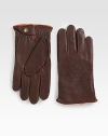 Smooth, luxurious leather with perforated fleur-de-lis detail.LeatherDry cleanImported