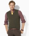 A classic sweater vest is the hallmark of preppy style in luxurious cable-knit merino lambswool.