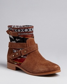 Loaded with Southwestern style, these Cynthia Vincent harness booties feature rugged suede and ikat print fabric, wrapped up with on-trend harness details.