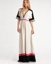 An elegant maxi silhouette, finished with bold colorblocking and snake-print details.V necklineDropped shouldersDolman sleevesPleating at bodiceMock beltGathered skirtConcealed side zipperAbout 64 from shoulder to hemPolyesterDry cleanImported