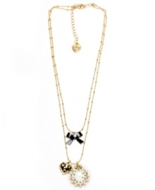 Time for love. This beautiful Betsey Johnson necklace features a leopard heart, decorative clock and bow in mixed metal with crystal accents. Approximate length: 16 inches. Approximate drop: 1-1/2 inches.