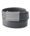 Change up your look with the reversible design of this modern-minded plaque buckle belt in smooth leather from Tumi.