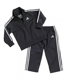 Adidas iconic sporty style infuses the zip jacket and matching pant, creating a cool, comfortable look for the playground and ball court alike. Adidas iconic sporty style infuses the zip jacket and matching pant, creating a cool, comfortable look for the playground and ball court alike.