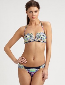 A bold, eclectic print and classic bikini silhouette combine to create an alluring design, including a removable halter strap for style versatility. Removable halter strapBandeau topBack clasp closureSexy, ruched sides on stretch bottomFully lined80% nylon/20% spandexHand washMade in USA A bold, eclectic print and classic bikini silhouette combine to create an alluring design, including a removable halter strap for style versatility. Removable halter strapBandeau topBack clasp closureSexy, ruched sides on stretch bottomFully lined80% nylon/20% spandexHand washMade in USA