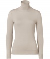 Luxe basics anchor any modern wardrobe, and Ralph Laurens beige merino wool pullover proves an elegant indispensable - Fitted, feminine cut tapers through waist - Long sleeves and turtleneck collar - Finely ribbed trim at cuffs and hem - Versatile and polished, seamlessly goes from work to weekend - Pair with everything from pencil skirts and suit trousers to skinny denim and leather pants