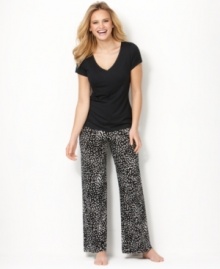 Stretch out and relax. The easy and flattering fit of this stretch top by Alfani is a welcome treat at the end of the day. Stretch out and relax. The easy and flattering fit of this stretch top by Alfani is a welcome treat at the end of the day.