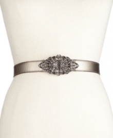 Let the light shine in with this shimmery leather belt from Fossil. Graced with a scrolling metal clasp encrusted with rhinestone embellishments. Let the light shine in with this shimmery leather belt from Fossil. Graced with a scrolling metal clasp encrusted with rhinestone embellishments.