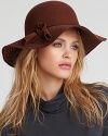 Swing into style in this elegant floppy hat with large tassel trim.