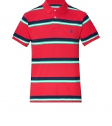 Must-have for the coming season is the classic polo shirt - This  version, from Ralph Lauren, the master of American style, features cool stripes in fine cotton, with embroidered signature logo on chest - Slim cut is longer in back than front - Try with favorite jeans, chinos or shorts for perfect preppy style
