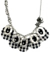 Make ready the raceway. FALCHI by Falchi's black and white print shell necklace adds energy to any look. Asymmetrical design set in silver tone mixed metal. Approximate length: 22 inches. Approximate drop: 2 inches.