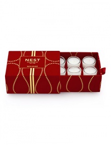 Captures the aroma of a sparkling holiday season. A total of six votives per box fragranced with inviting notes of pomegranate, mandarin orange, pine, cloves and cinnamon. Housed in elegant miniature glass vessels and presented in a red velvet box. Created by Laura Slatkin. Approximately 2 to 3 hours of burn time per votive. Captures the aroma of a sparkling holiday season. A total of six votives per box fragranced with inviting notes of pomegranate, mandarin orange, pine, cloves and cinnamon. Housed in elegant miniature glass vessels and presented in a red velvet box. Created by Laura Slatkin. Approximately 2 to 3 hours of burn time per votive.
