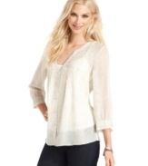 A subtle snakeskin print enlivens this semi-sheer top from Calvin Klein Jeans. Try it with dark jeans for a weekend look that stays put-together.