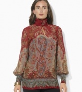 Lauren Ralph Lauren's breezy blouse is finished with a buttoned mockneck and elegant puffed sleeves.