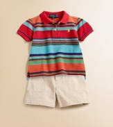 A bold stripe pattern updates a classic polo shirt in breathable cotton mesh.Ribbed polo collarShort sleevesFront button placketUneven vented hemCottonMachine washImported Please note: number of buttons may vary depending on size ordered. 
