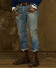 Signs of fading with rips and repairs lends a vintage workwear vibe to a pair of well-worn jeans in light-wash denim. Signs of fading with rips and repairs lends a vintage workwear vibe to a pair of well-worn jeans in light-wash denim.