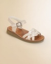 A graceful basketweave front of faux patent leather straps distinguishes this summery style.Faux patent leather upperBuckle ankle strapFaux leather footbedMini wedge composite rubber soleImported